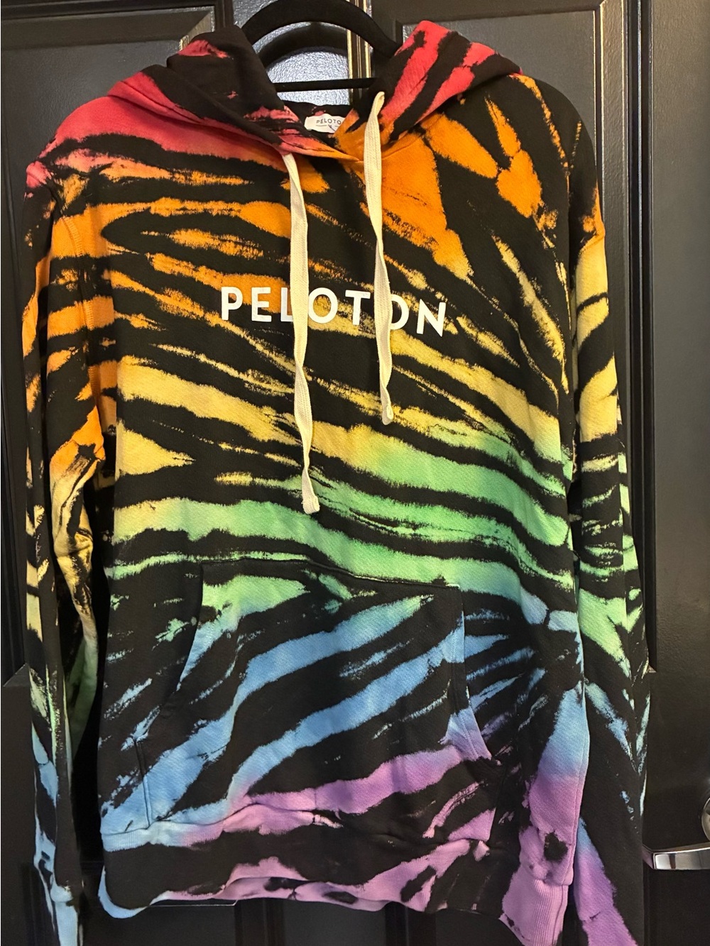 Peloton Pride Hoodie with Black and Orange Tie-Dye Accents